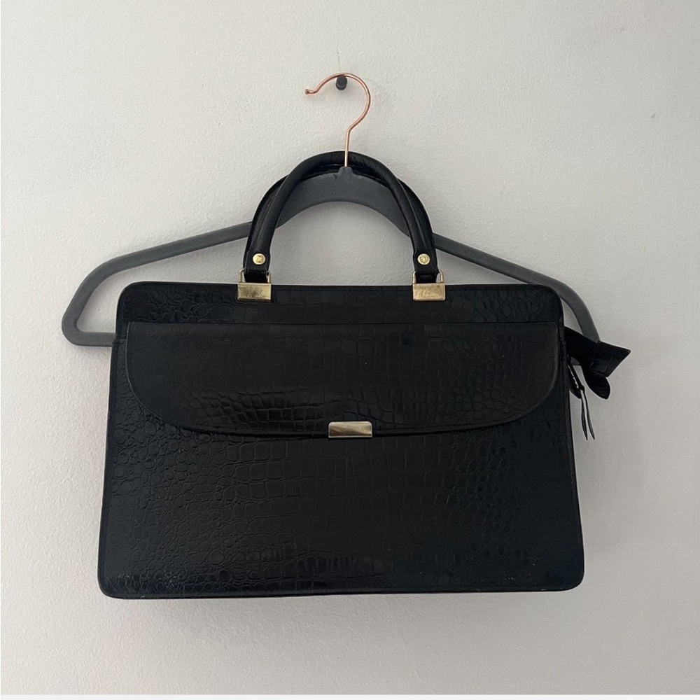 Black crocodile leather bag.